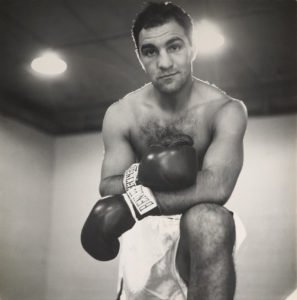 Rocky Marciano Looks into camera in boxing gloves