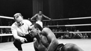 Bob Foster knocked down, Ali looks on from corner