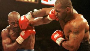 Mike Tyson and Evander Holyfield trades punches