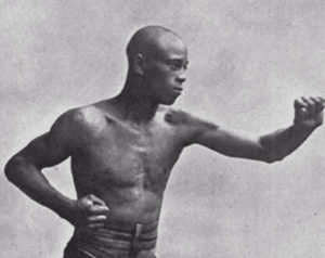 Young fighter Jack Blackburn in a fighting pose