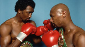 Marvin Hagler and Thomas Hearns strike fighting poses