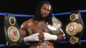 Lennox Lewis with championship belts
