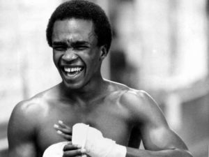 Sugar Ray Leonard wraps his hand and laughs