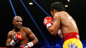 Floyd Mayweather smiles at Manny Pacquiao during their bout
