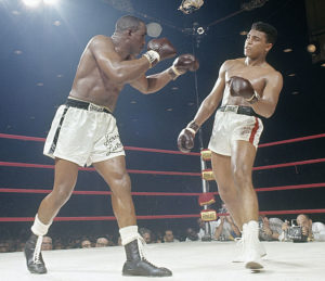 Liston throws a punch at Cassius Clay