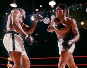Cassius Clay throws a punch at Sonny Liston