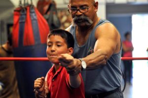 Boxing trainer and young fighter