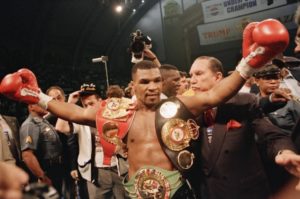 Mike Tyson with championship belts